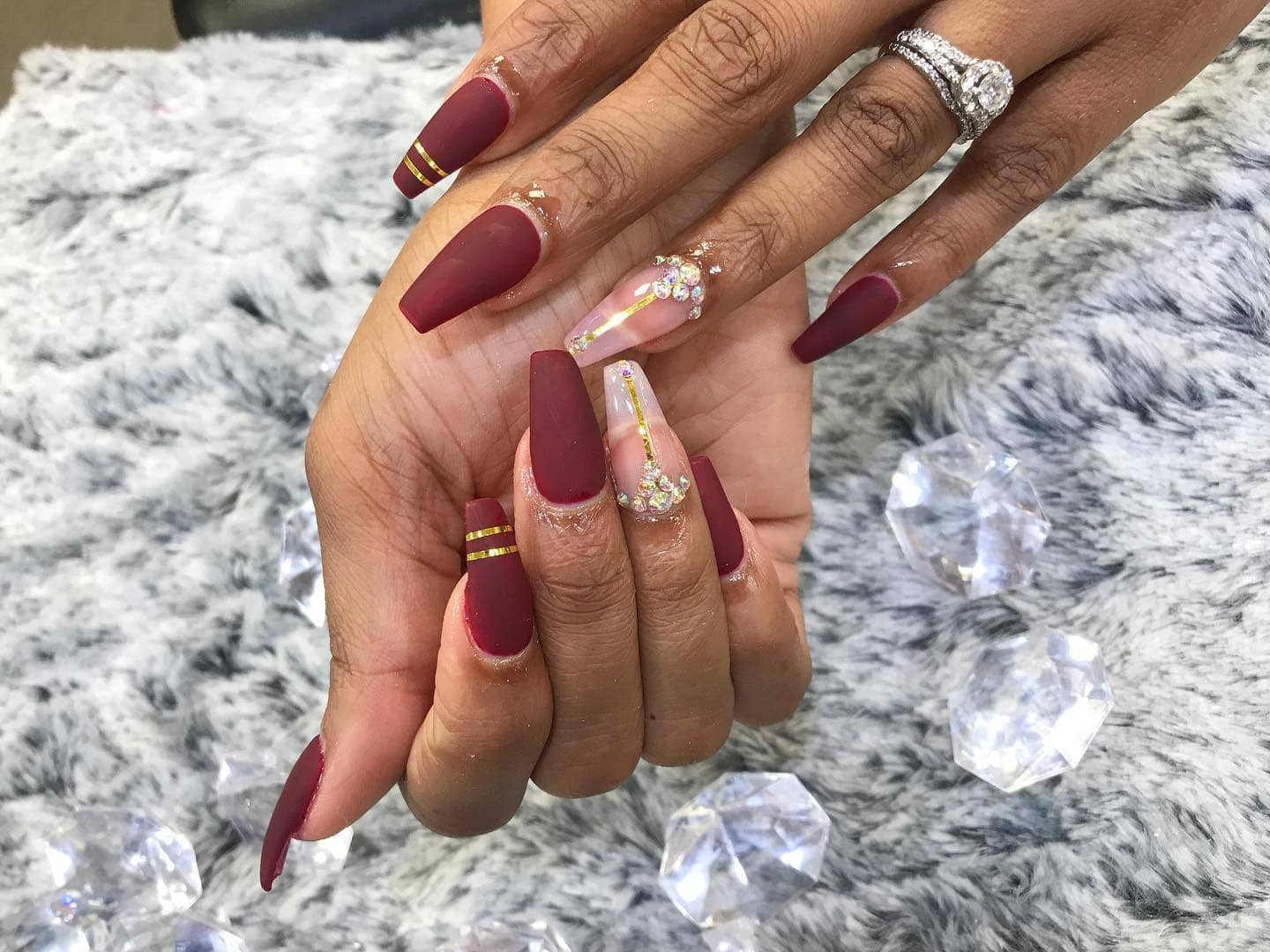 8. Matte Burgundy with Crystal and Gold Accents - burgundy and gold nail ideas