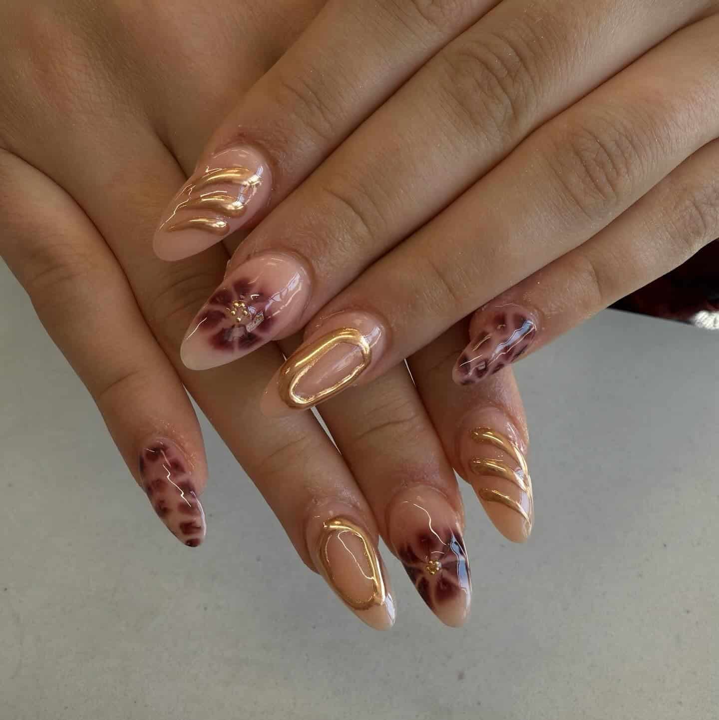 12. Burgundy Floral Art with Sculpted Gold Accents - burgundy and gold nail ideas