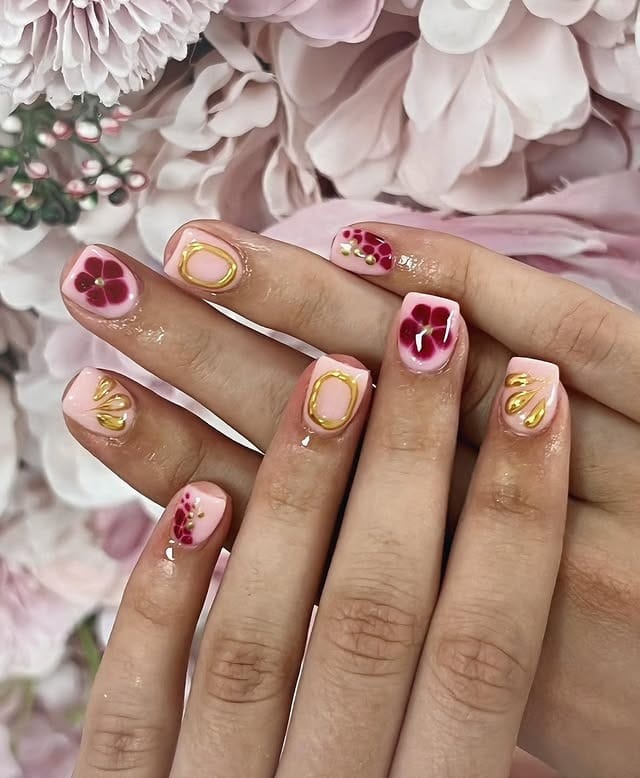 14. Burgundy Florals with Gold Outline on Short Nails - burgundy and gold nail ideas