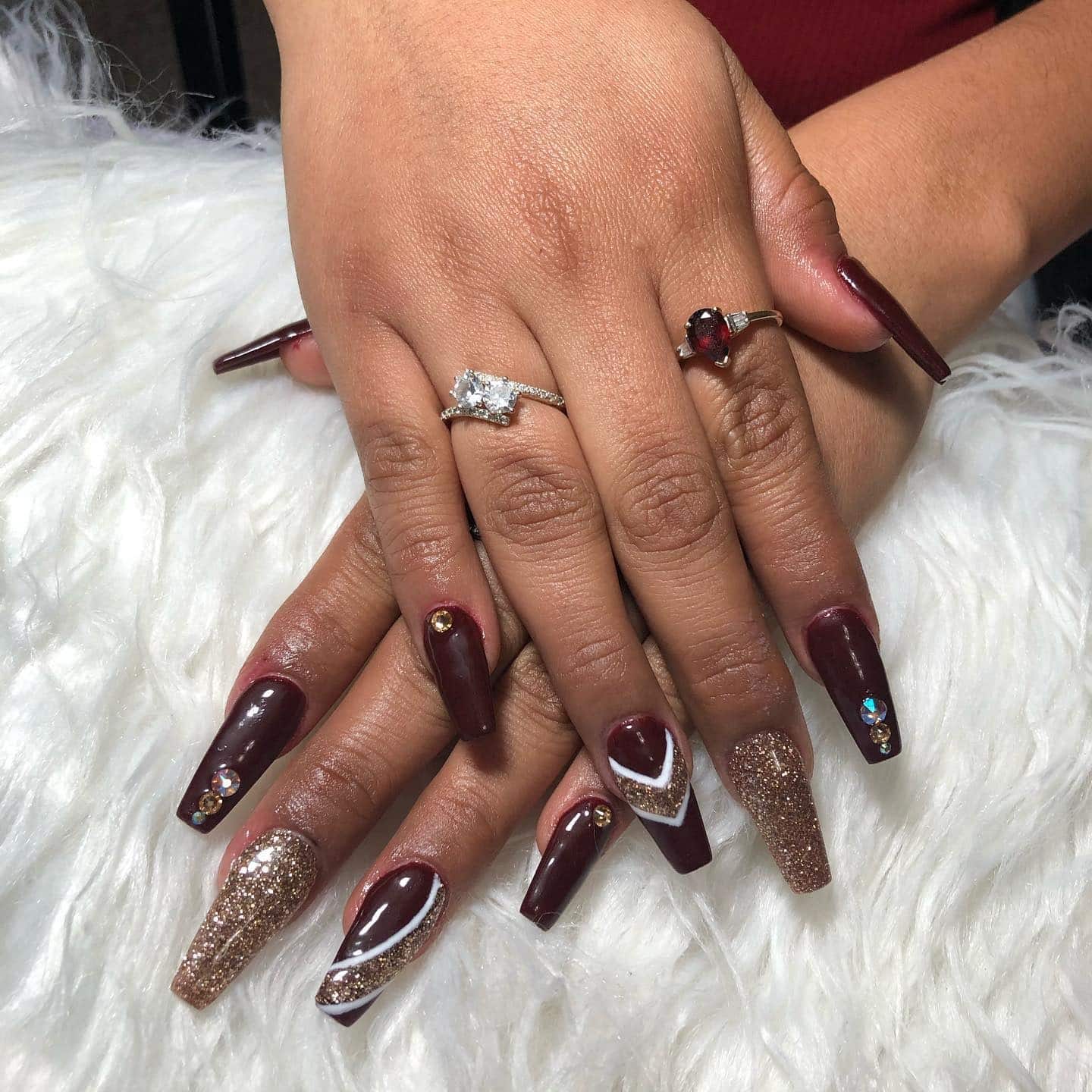 16. Burgundy and Gold with Glittered Statement Nails - burgundy and gold nail ideas