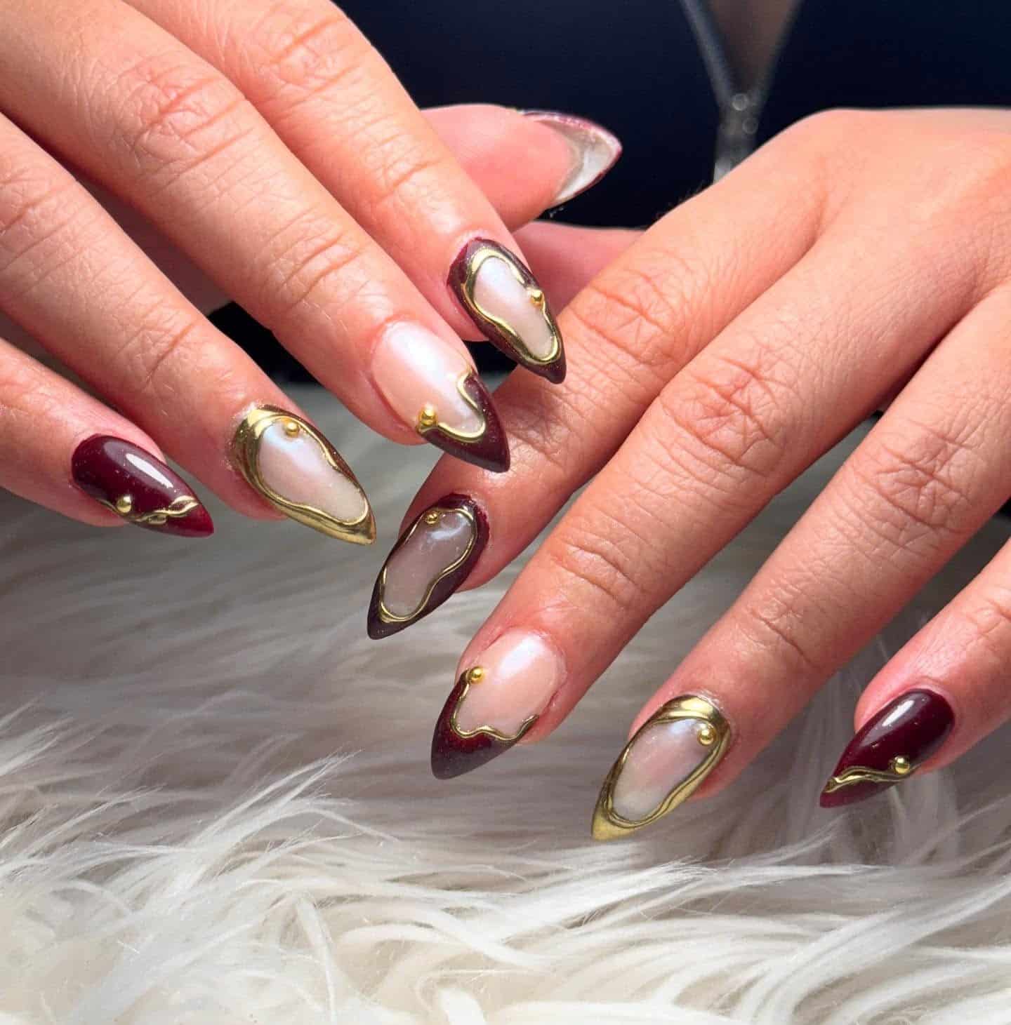 17. Burgundy and Gold Framed Abstract Design - burgundy and gold nail ideas