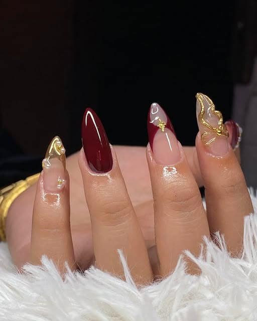 19. Burgundy Accent with Gold-Sculpted Highlights - burgundy and gold nail ideas