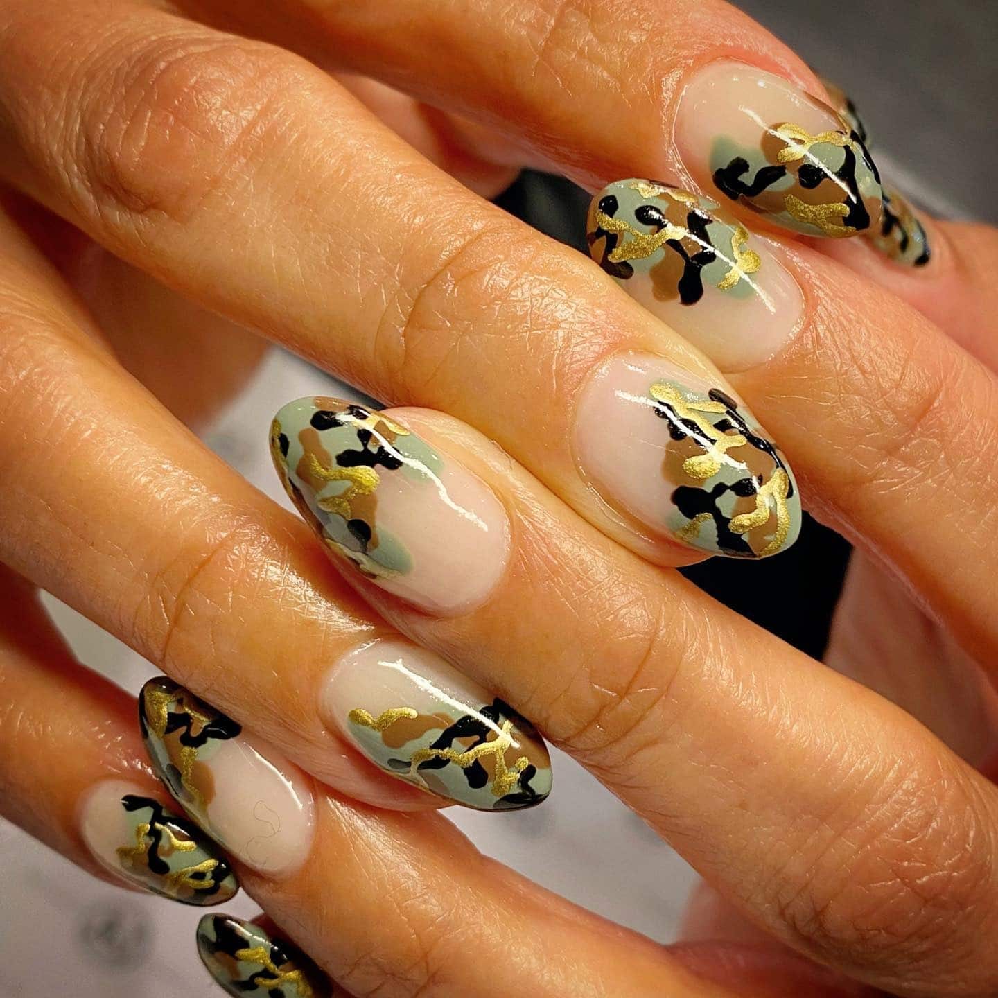 11. Golden Camouflage Elegance - camouflage nail ideas