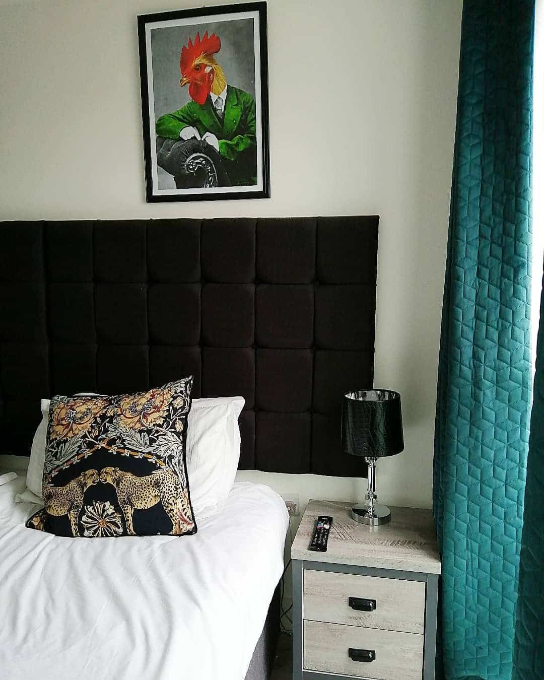 22. Eclectic Edge with Playful Art - black and green bedroom ideas