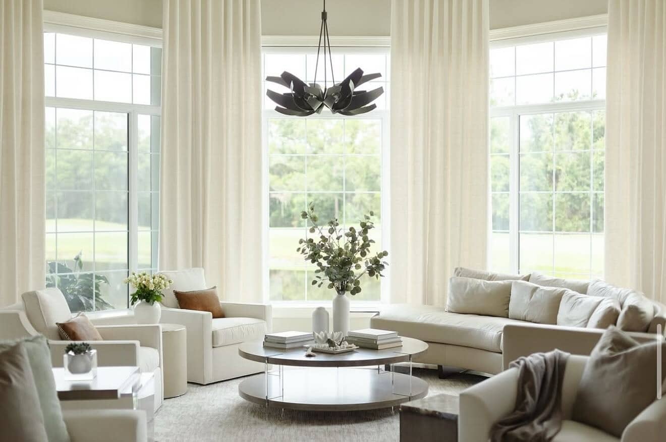 3. Expansive Elegance in Cream - neutral living room ideas