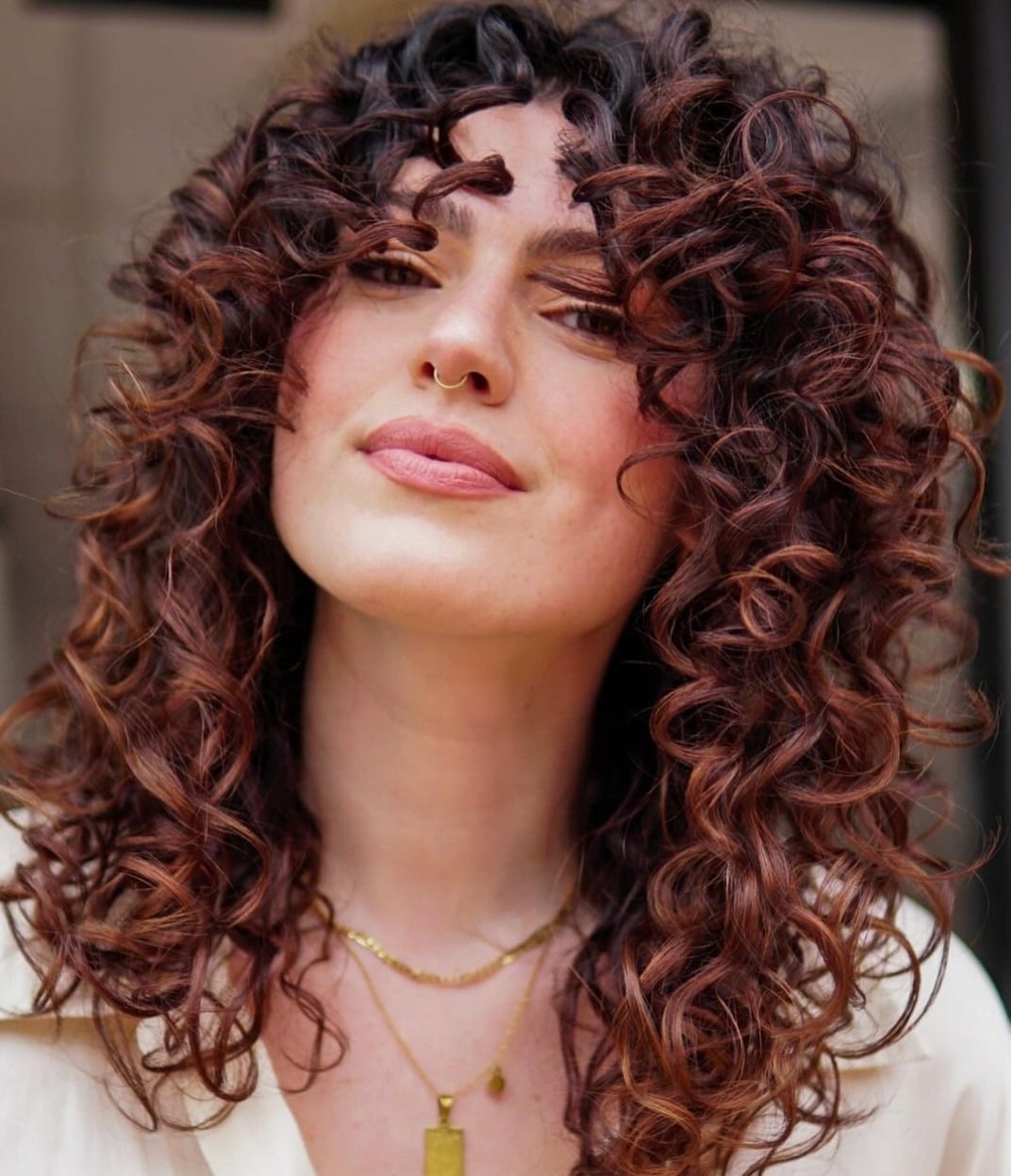 7. Defined Curls with Chocolate Cherry Dimension - Chocolate Cherry Hair Color