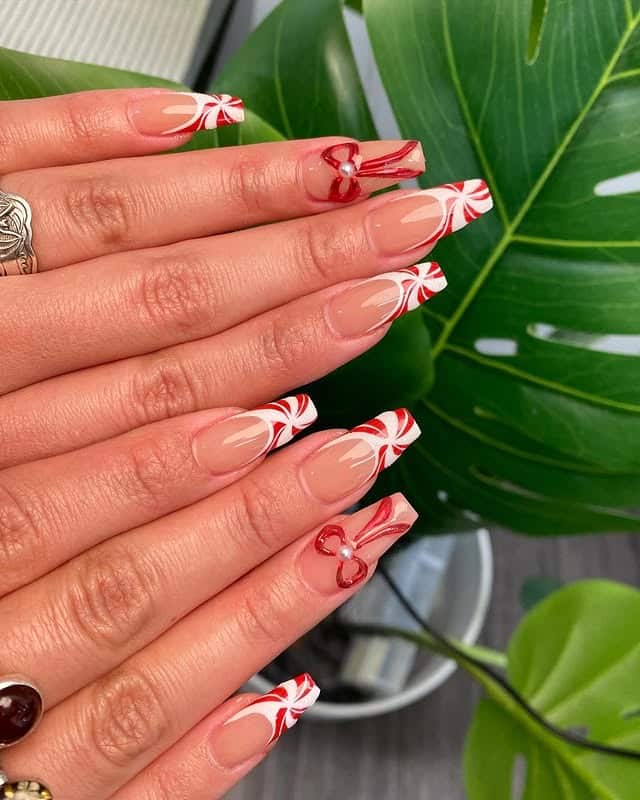 7. Candy Cane Striped French Tips - christmas french tip nail ideas