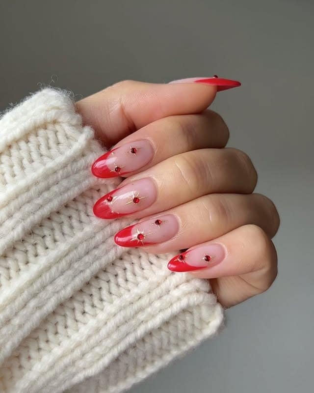 9. Red French Tips with Crystal Stars - christmas french tip nail ideas