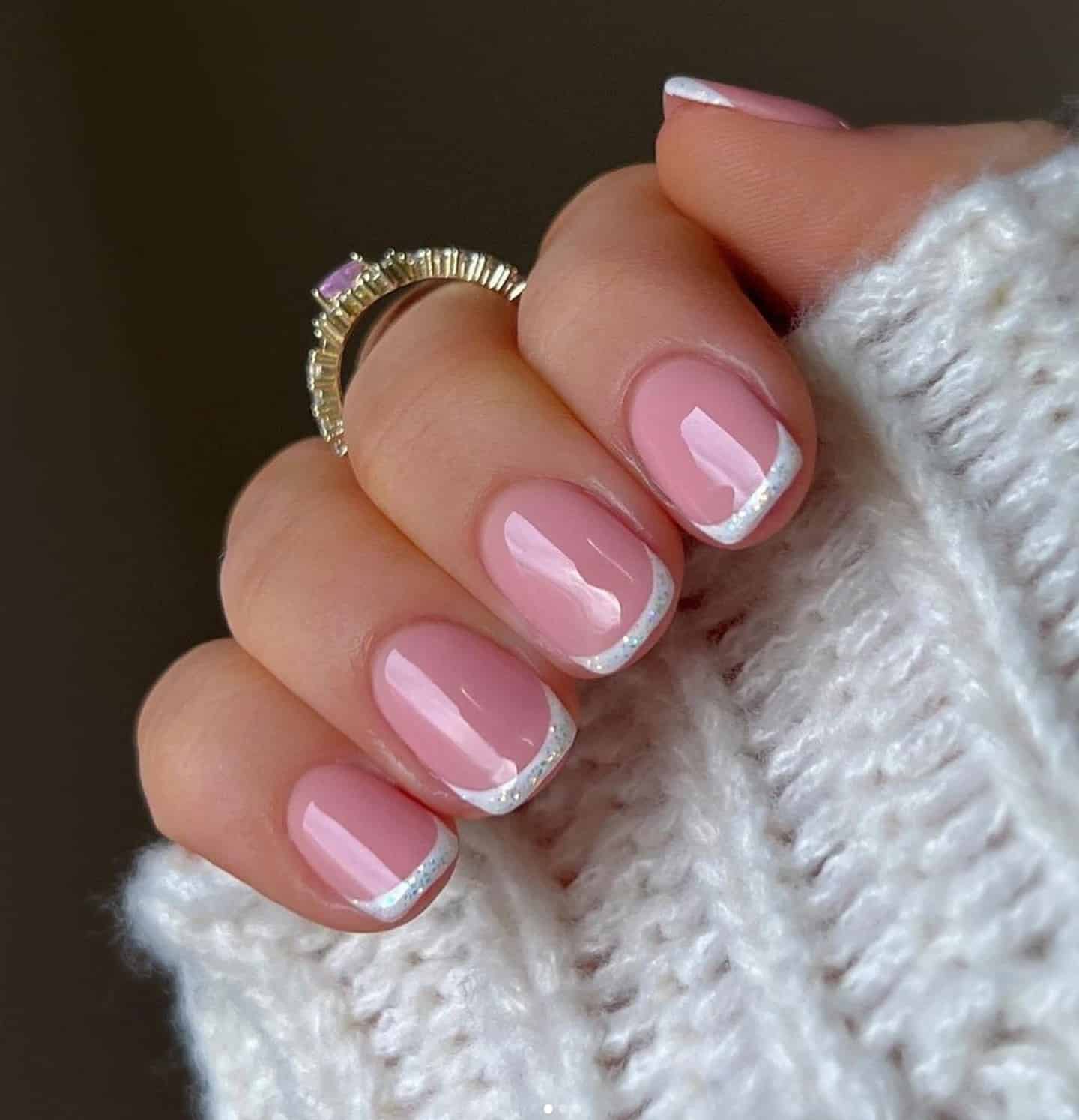 16. Soft Glitter White French Tips - christmas french tip nail ideas