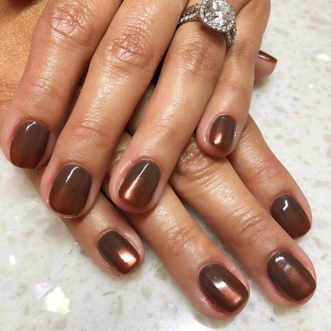 7. Bronze Glow Short Nails - copper color nail ideas