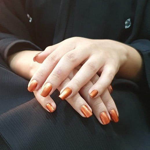 14. Polished Copper Almond Nails - copper color nail ideas