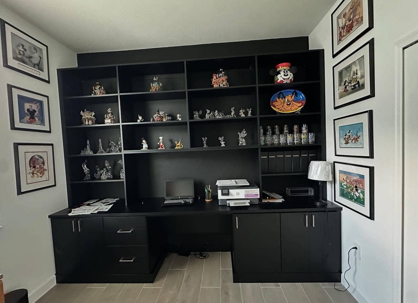 8. Collectors’ Display with Playful Energy - black office ideas