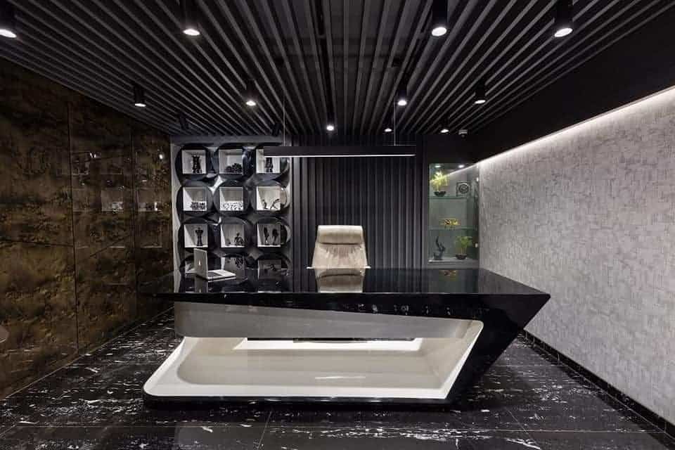15. High-Gloss Drama with Sculptural Desk - black office ideas