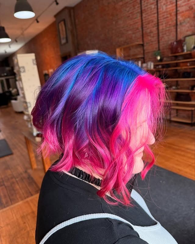 6. Neon Magenta Bob with Indigo Depth - Vivid Hair Color