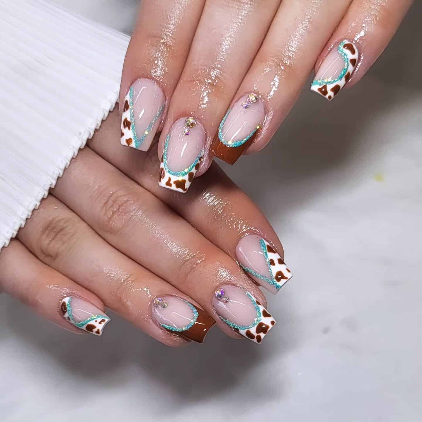 5. Cowhide French with Turquoise Lines - cowgirl nail ideas