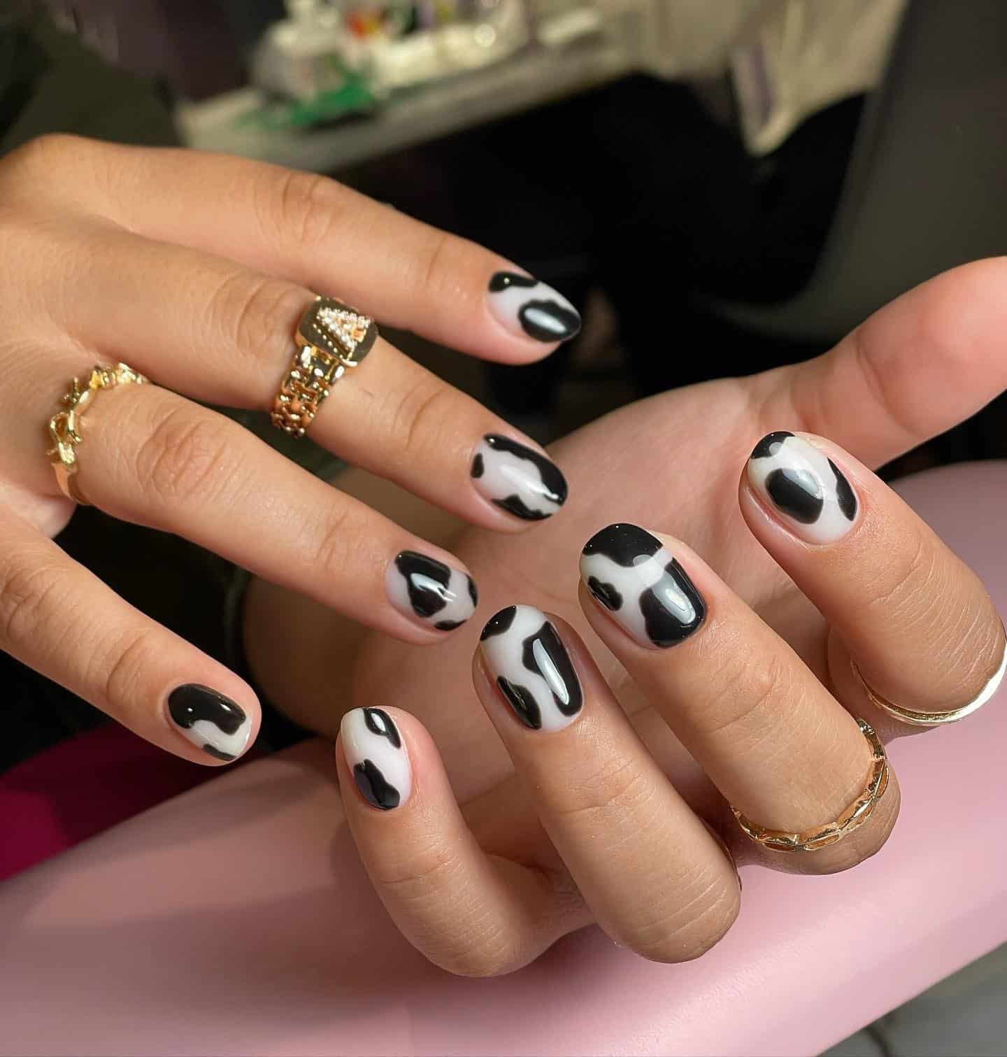 18. Classic Black and White Cow Print - cowgirl nail ideas