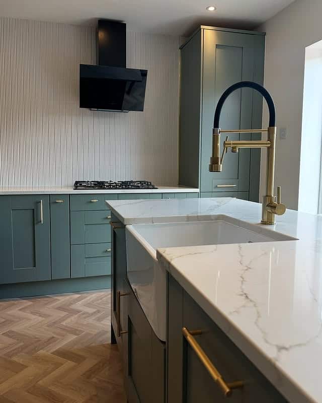 4. Contemporary Green with Brass Detailing - kitchen cabinet ideas