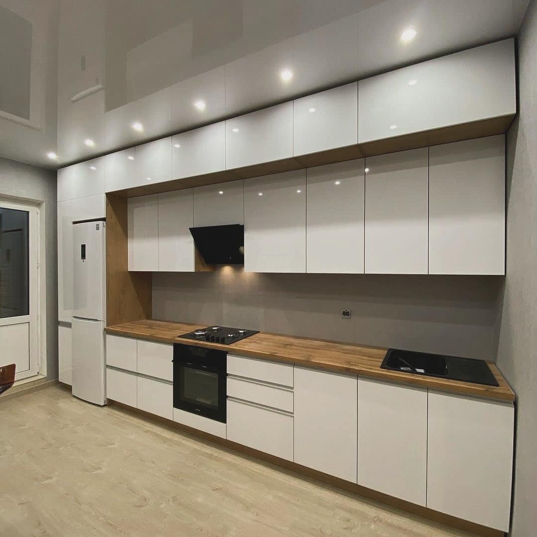 17. Streamlined White with Wooden Countertop - kitchen cabinet ideas