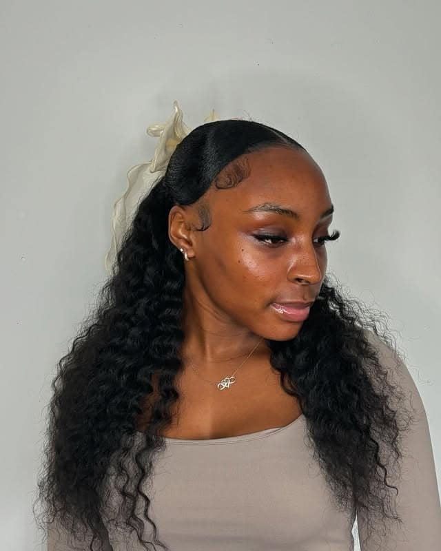 13. Sleek Low Pony with Natural Waves - Quick Weave Hairstyles