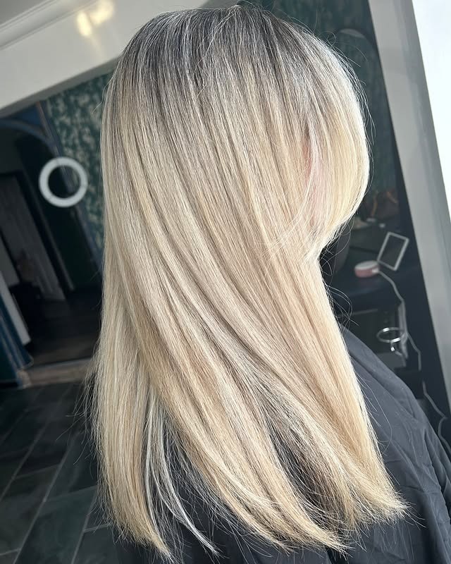 3. Sleek Ash Blonde with Natural Roots - Light Ash Blonde Hair Color