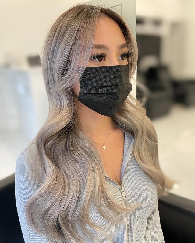 7. Cool Ash Blonde with Glamorous Waves - Light Ash Blonde Hair Color