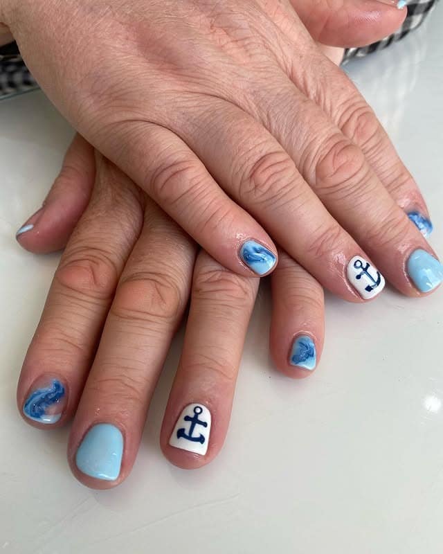 9. Sky Blue & Marble Anchors - cruise ship nail ideas