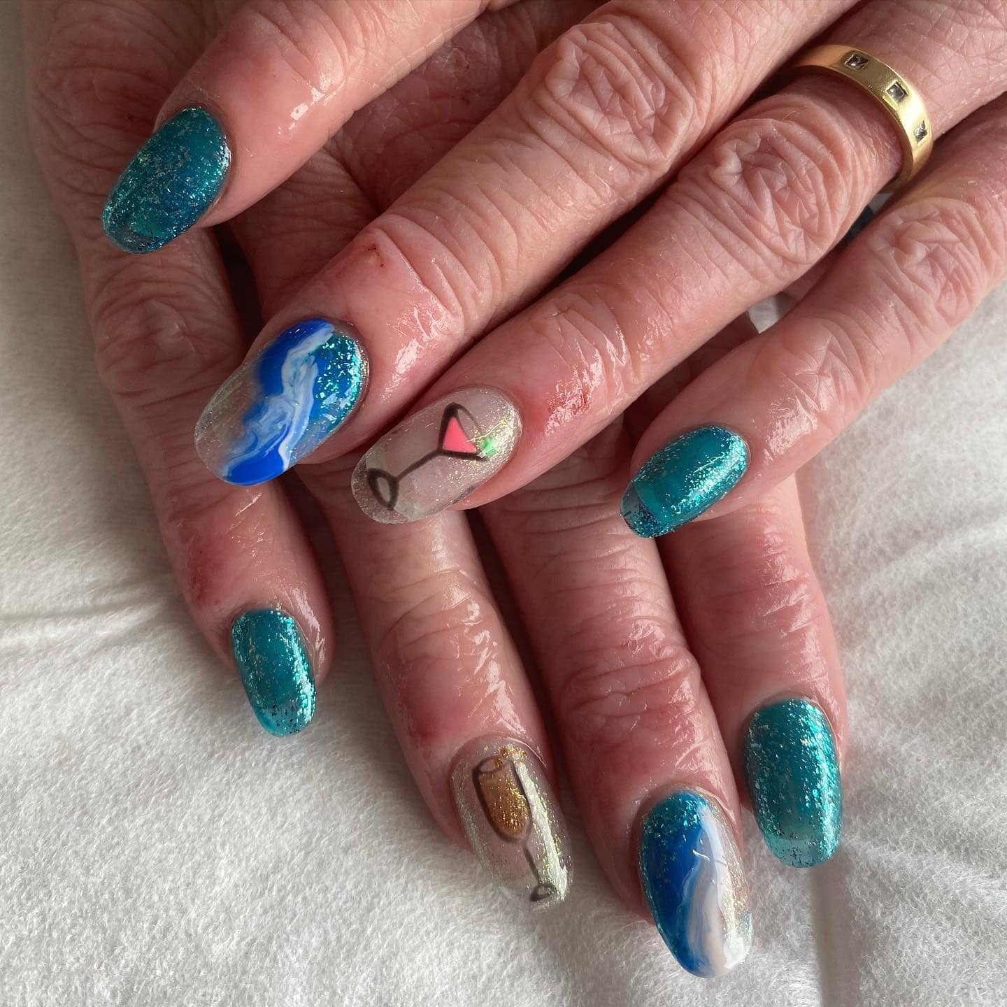 10. Teal Waves & Cocktails - cruise ship nail ideas