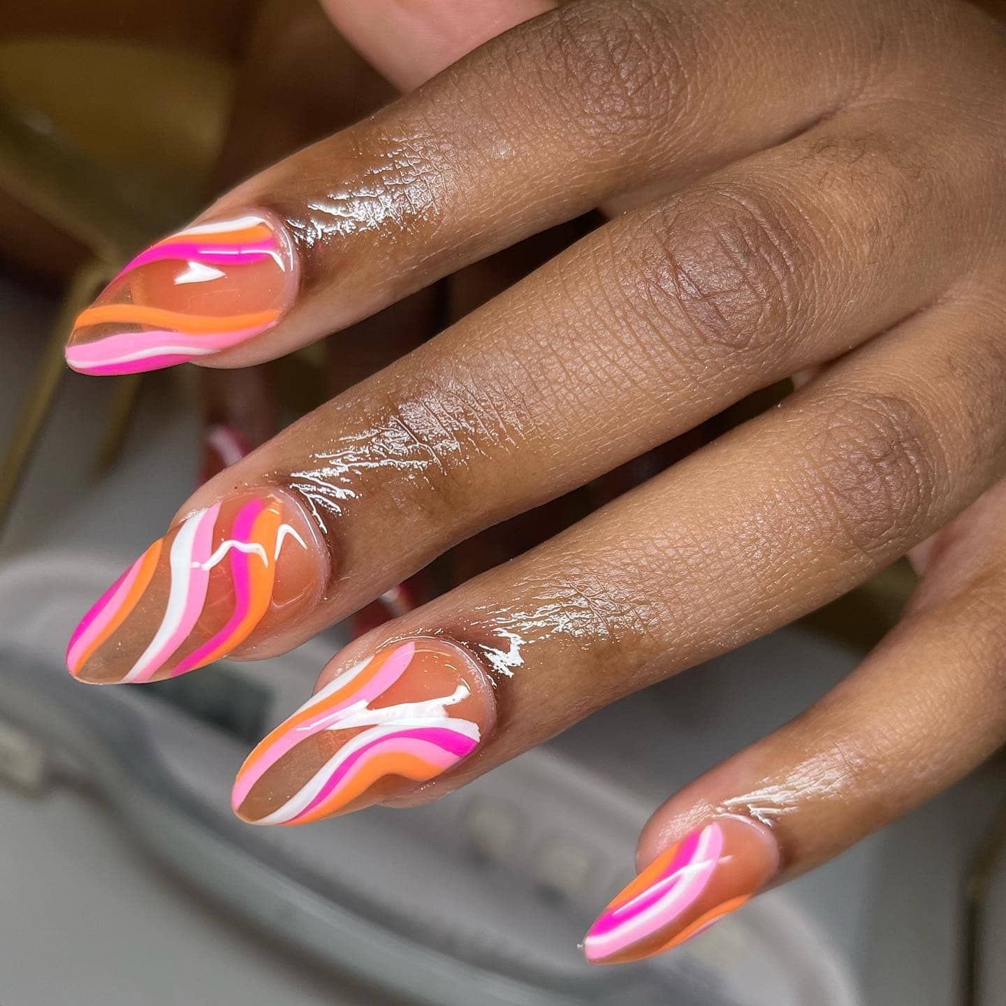 15. Sunset Wave Swirls - cruise ship nail ideas