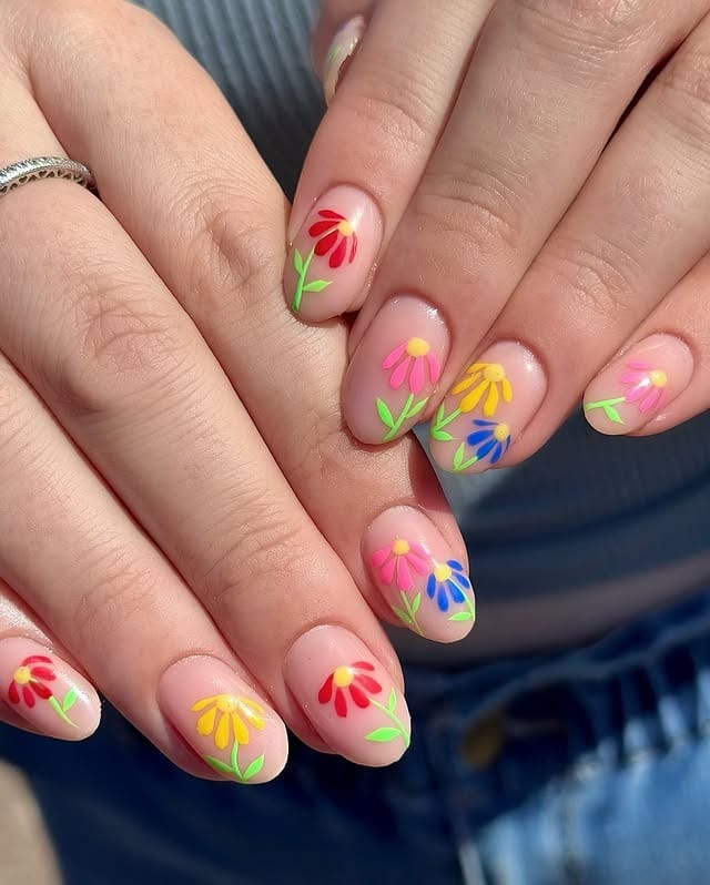 7. Rainbow Garden Blooms - cute flower nail ideas