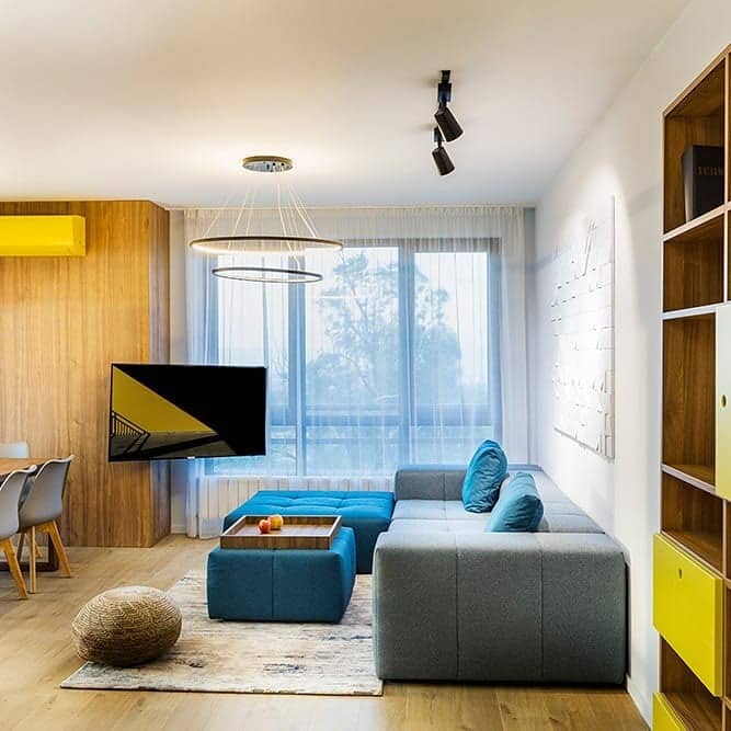 2. Contemporary Freshness with a Pop of Yellow - gray and yellow living room ideas