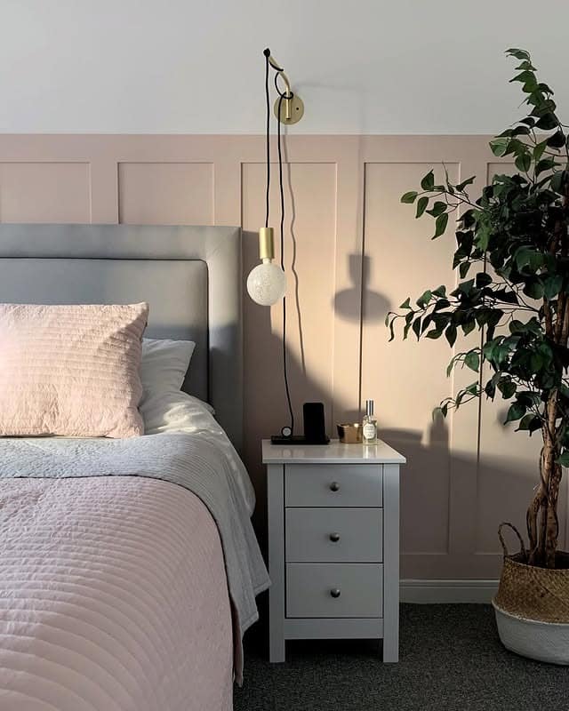 18. Blush Paneling with Modern Lighting - pink and gold bedroom ideas