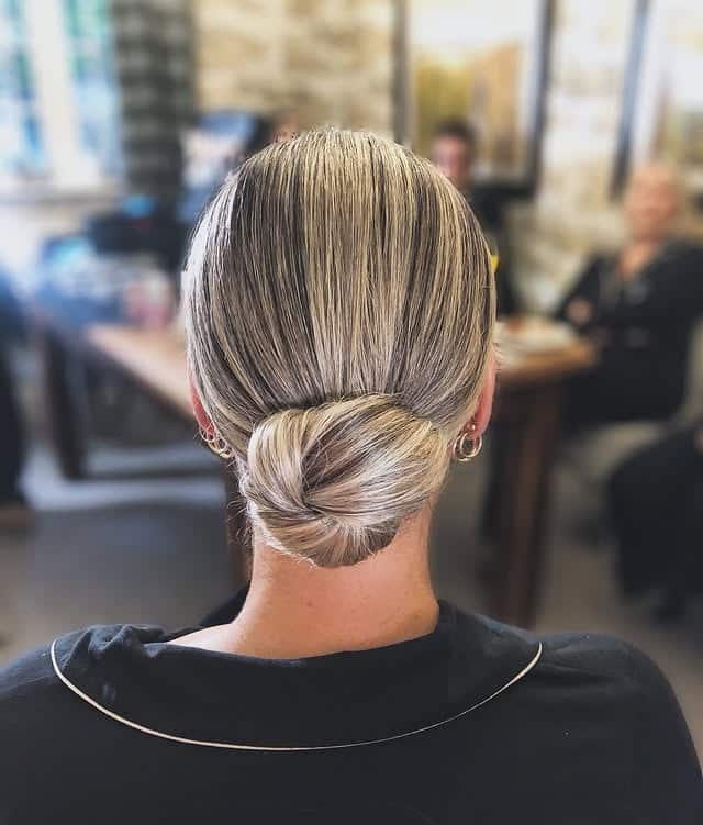 20. Sleek Knot Bun with Platinum Blending - Sleek Hairstyles