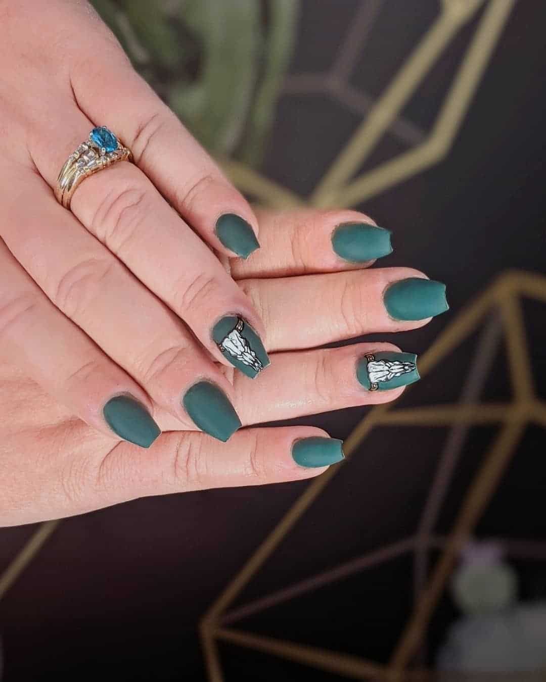 6. Matte Teal with Artistic Detail - dark teal nail ideas