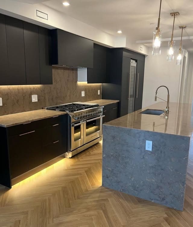 12. Modern Drama with Smoky Quartz - countertop ideas for kitchen