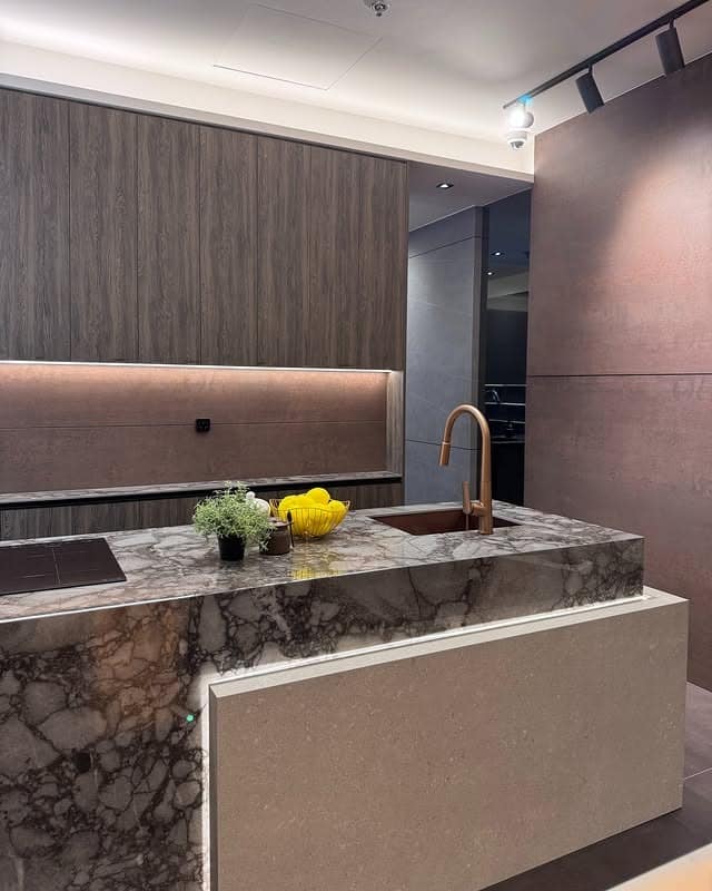 13. Contemporary Contrast with Textured Stone - countertop ideas for kitchen