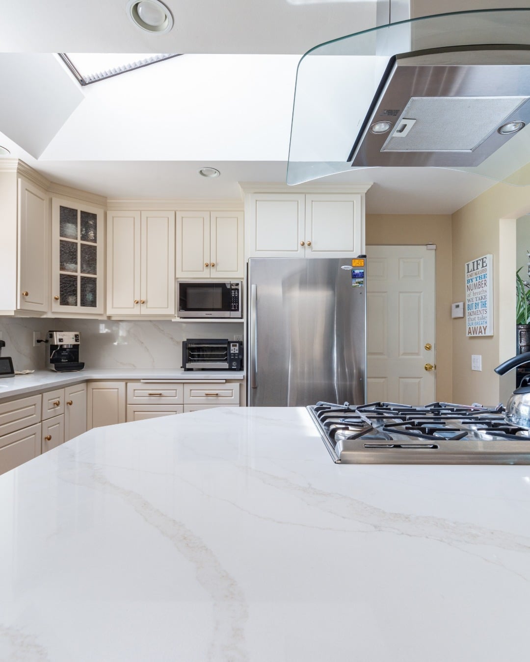 18. Soft White Quartz with Gentle Veining - countertop ideas for kitchen