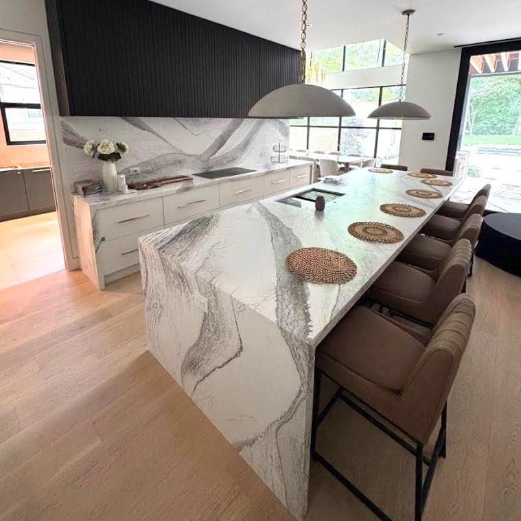 21. Waterfall Design with Dramatic Gray Veining - countertop ideas for kitchen