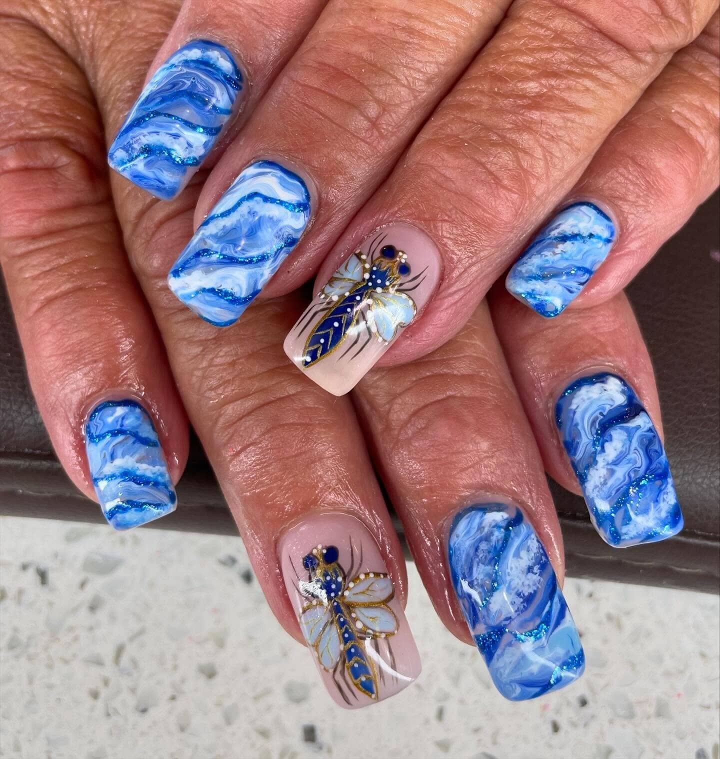11. Ocean Wave Marble Dragonfly Nails - dragonfly nail ideas