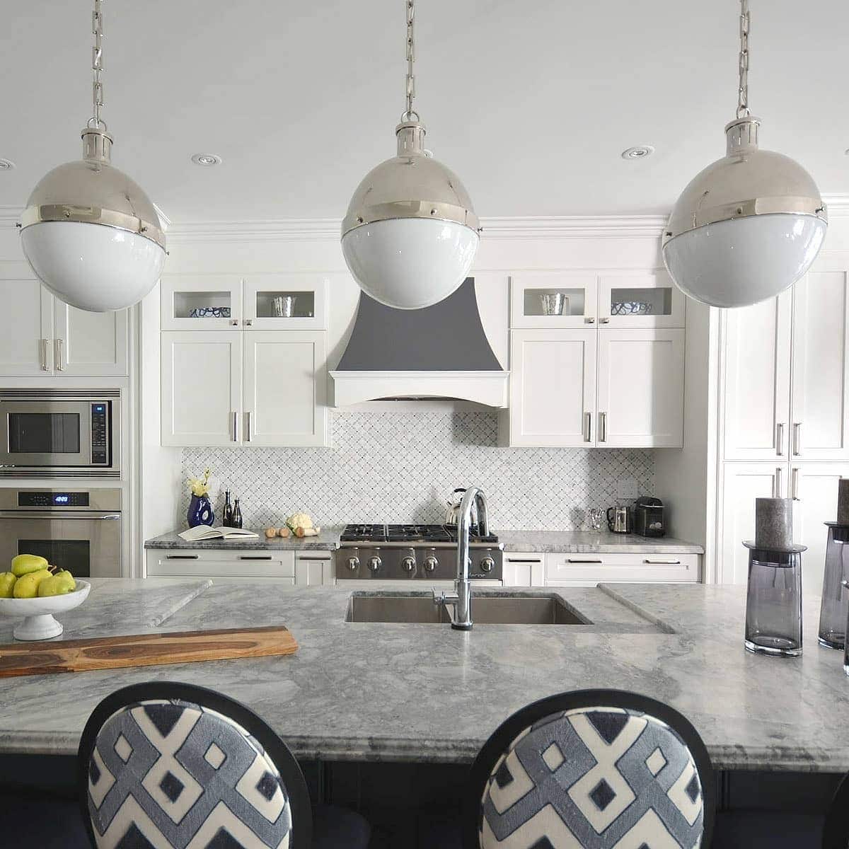 5. Classic Gray Sophistication with Polished Details - gray kitchen backsplash ideas