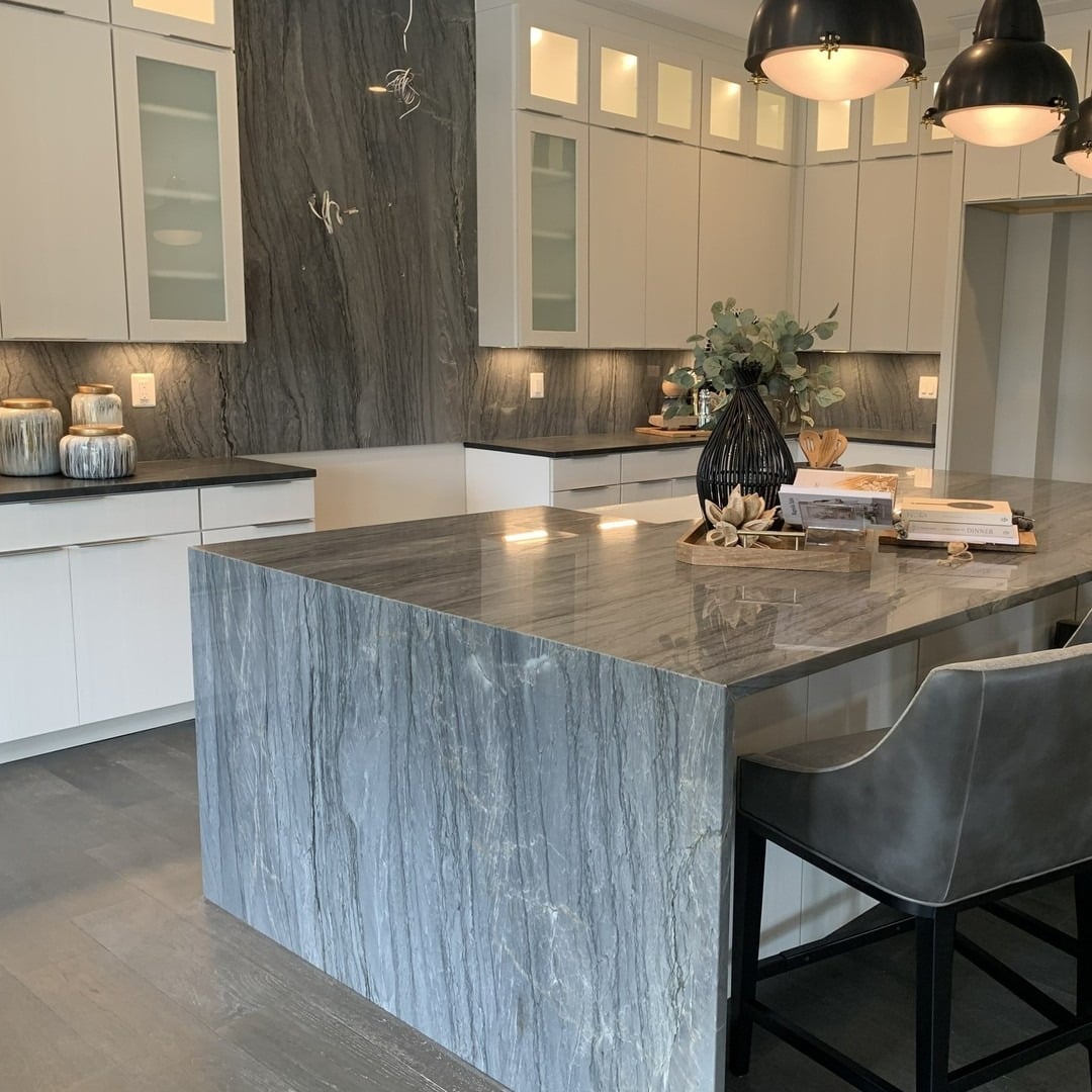 15. Dramatic Stone Veining with Deep Charcoal Undertones - gray kitchen backsplash ideas