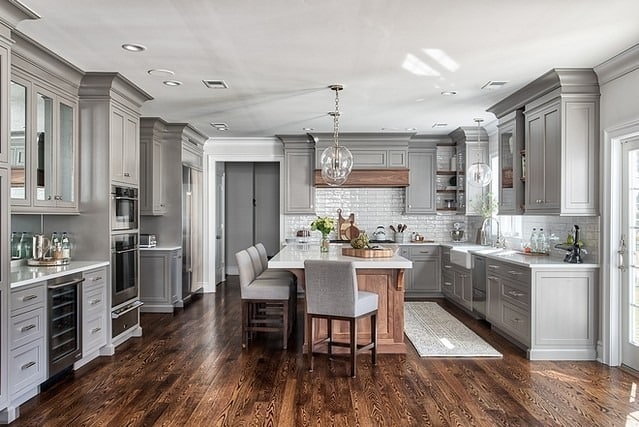 18. Classic Elegance with a Touch of Warm Gray - gray kitchen backsplash ideas