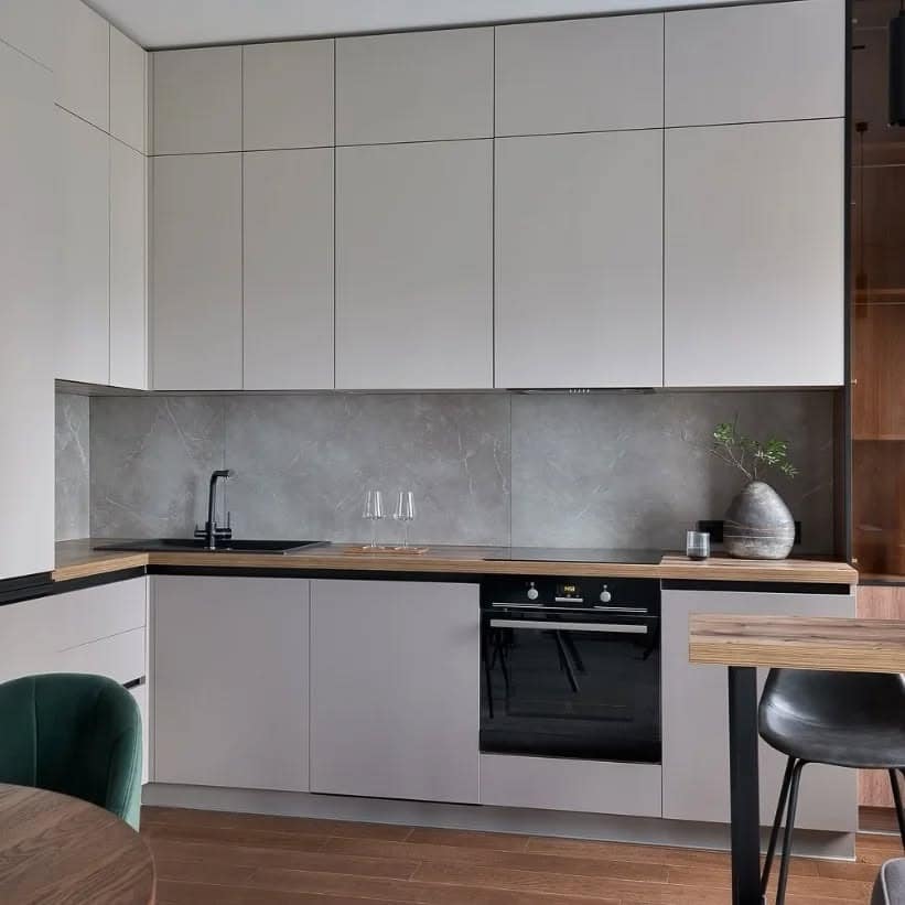 20. Monolithic Gray Marble Simplicity - gray kitchen backsplash ideas