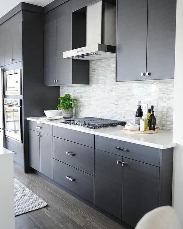 21. Charcoal Precision with Silver Mosaic Accents - gray kitchen backsplash ideas