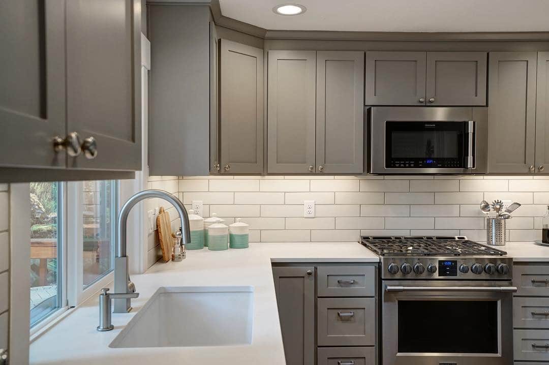 22. Soft Gray Sophistication with Subway Tile Warmth - gray kitchen backsplash ideas