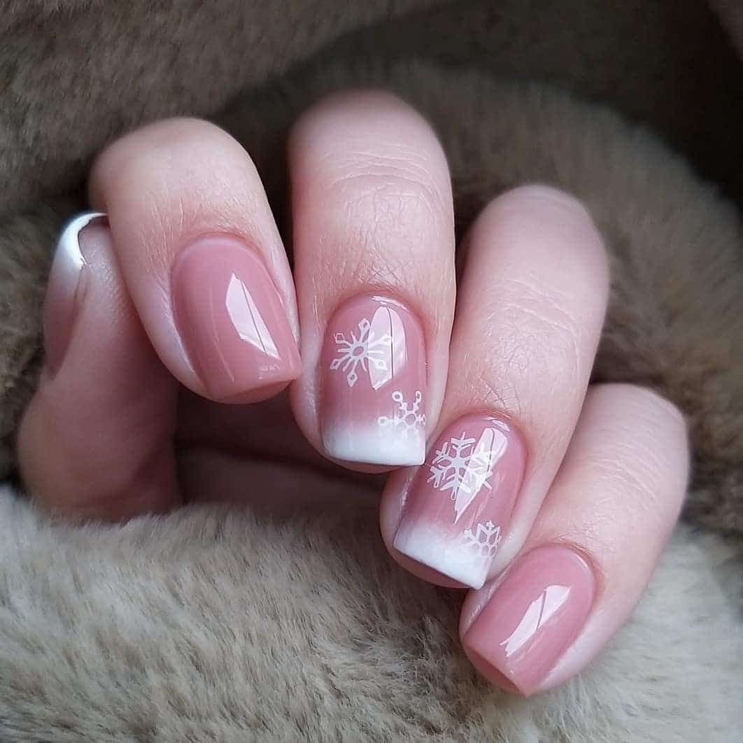 1. Frosted Blush French with Snowflake Detail - easy winter nail ideas
