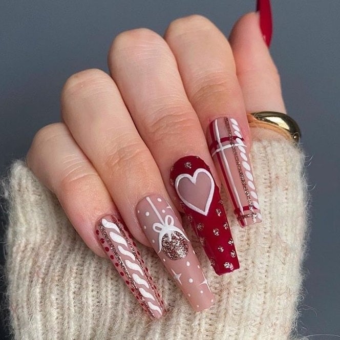 8. Candy Cane Red with Holiday Accents - easy winter nail ideas