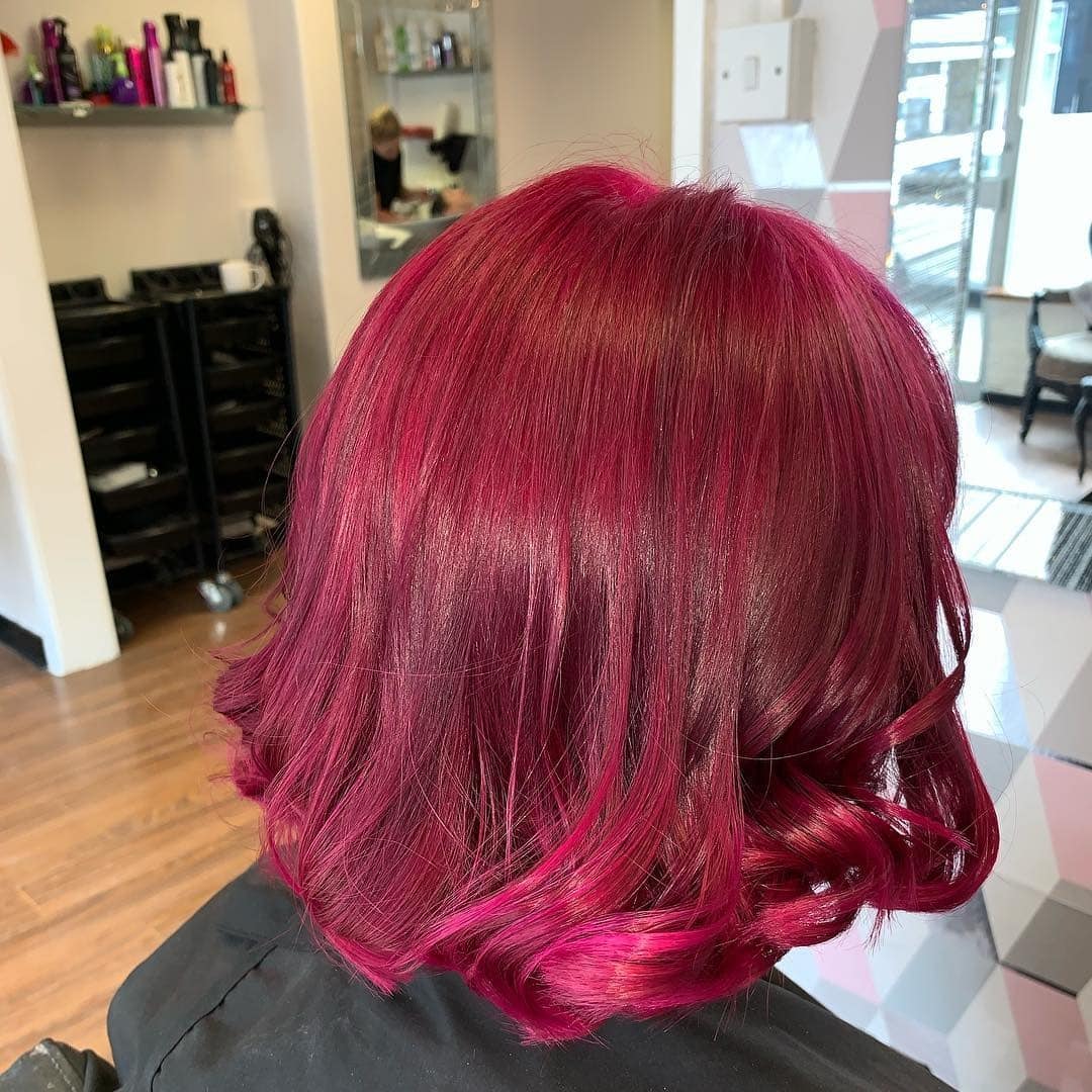 8. Sleek Plum-Red Blend with Polished Ends - Dark Pink Hair Color