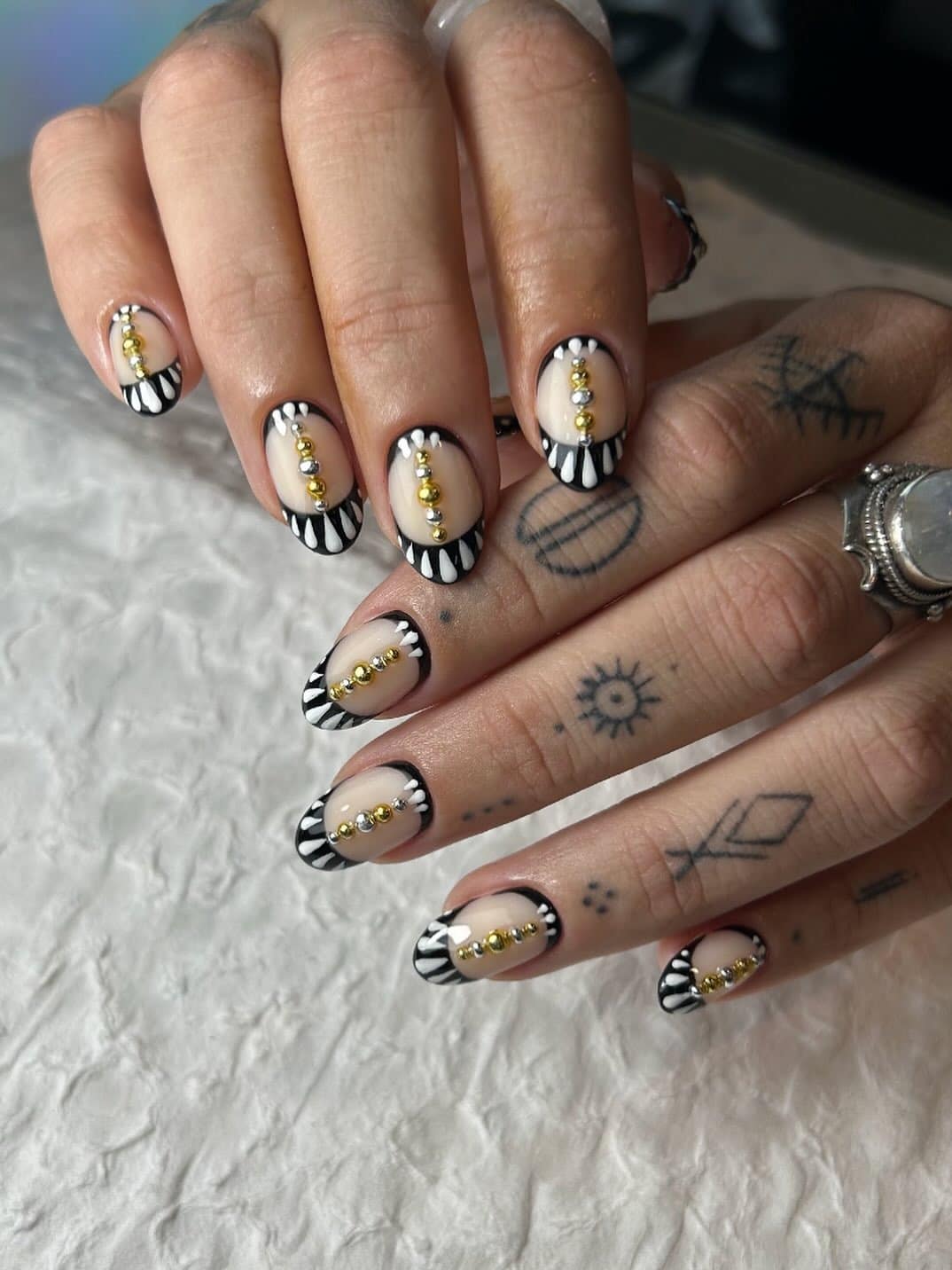 8. Gold-Spiked Stripes - edgy nail ideas