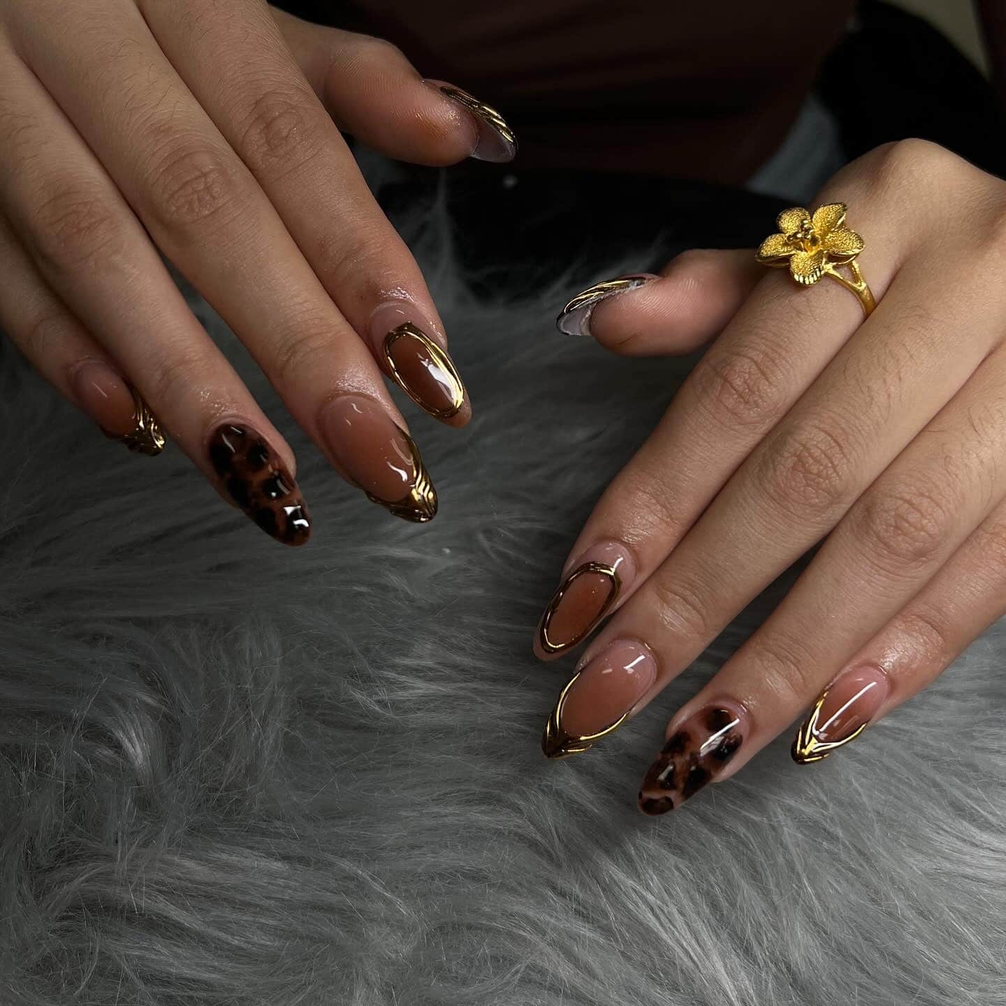 14. Golden Tortoise Elegance - edgy nail ideas