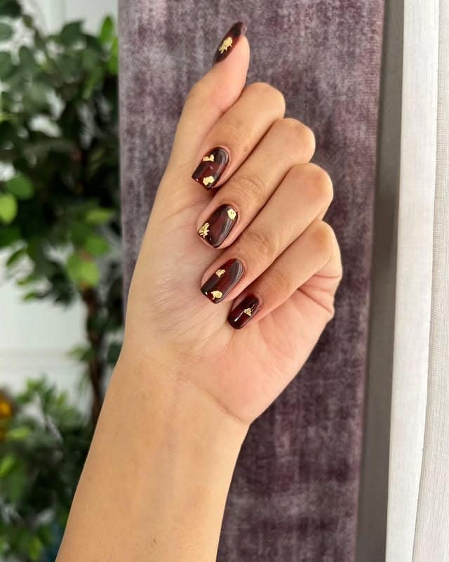 20. Gilded Mahogany Shards - edgy nail ideas